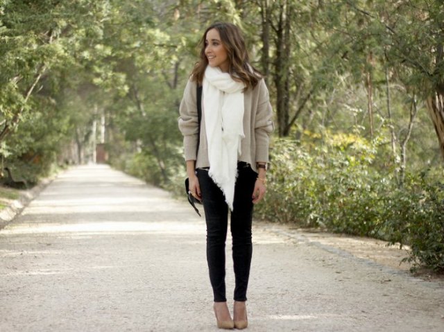 light gray sweater with white scarf and black skinny jeans