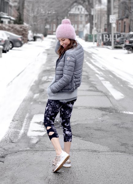 gray down jacket with black and white printed, narrow, short-cut leggings