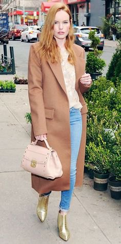 Blushing pink wool maxi coat with blouse with floral pattern and light blue skinny jeans