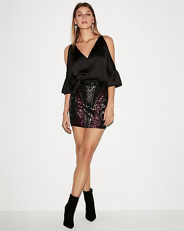 cold shoulder chiffon v-neck blouse with black high rise sequin mini skirt