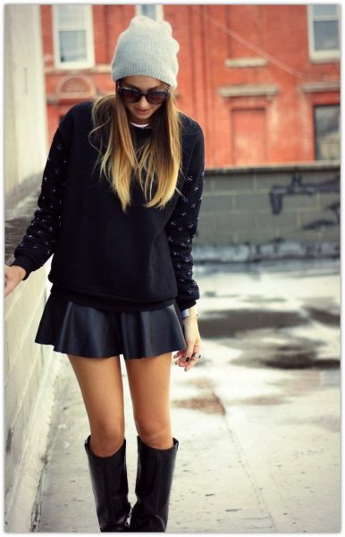 black, chunky sweater with mini rat skirt and knee-high boots