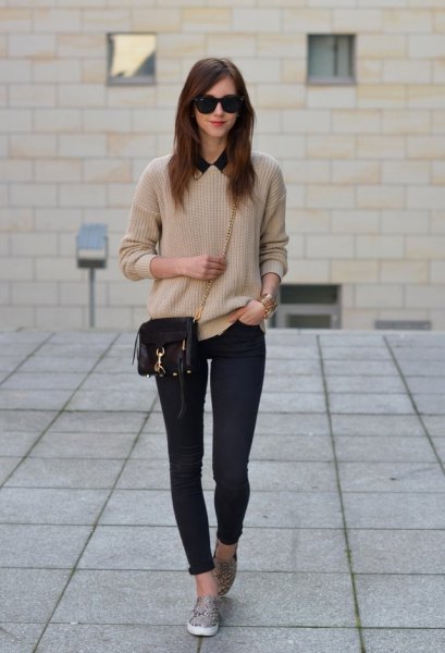 Blushing pink sweater with dark blue skinny jeans and slip-on-slip on hiking boots