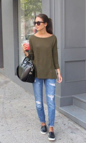 green long-sleeved t-shirt with a boat neck and torn slim fit jeans