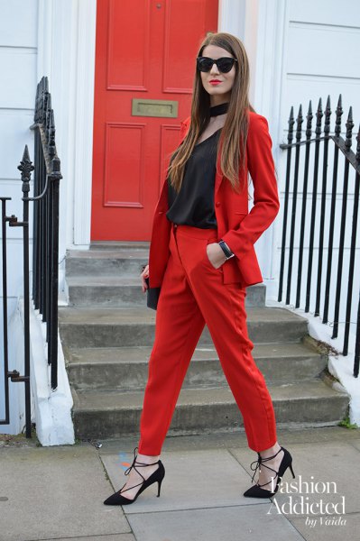 red suit with black scoop neck and collar