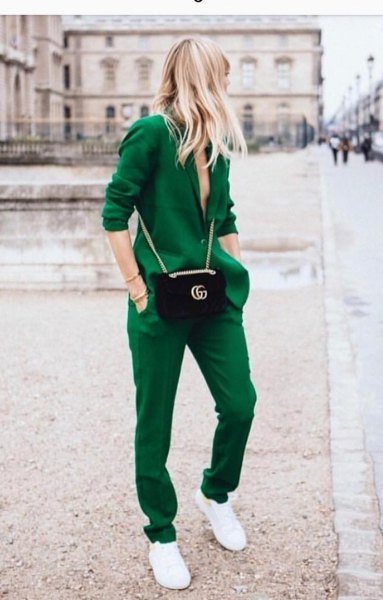green blazer with matching trousers and sneakers