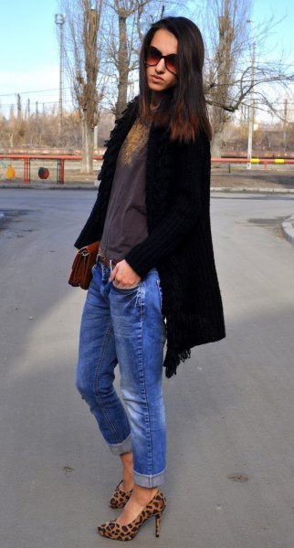 black long cardigan with blue jeans and shoes with animal print