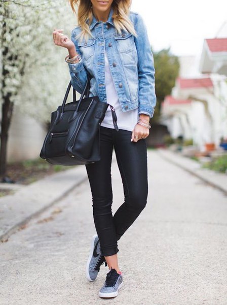 blue denim jacket with black leather pants and gray hiking tennis shoes