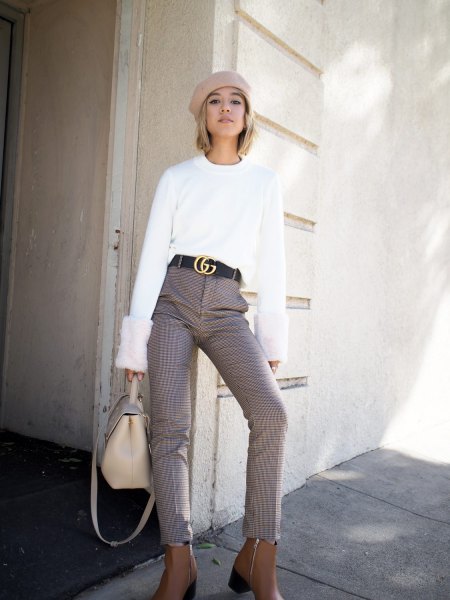 white sweater with light pink painter hat and statement belt