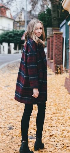 Dark blue and red checked coat with black skinny jeans and boots