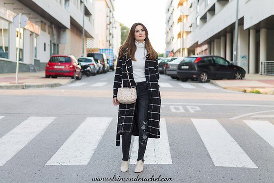 black and white checkered long wool coat with white sweater with false neck