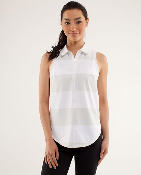white and gray sleeveless golf shirt with black skinny jeans