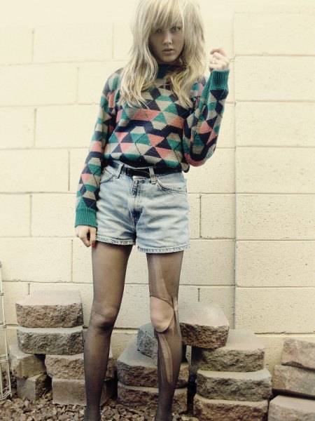 Sweater with blush and black diamond print and high waisted denim shorts with belt