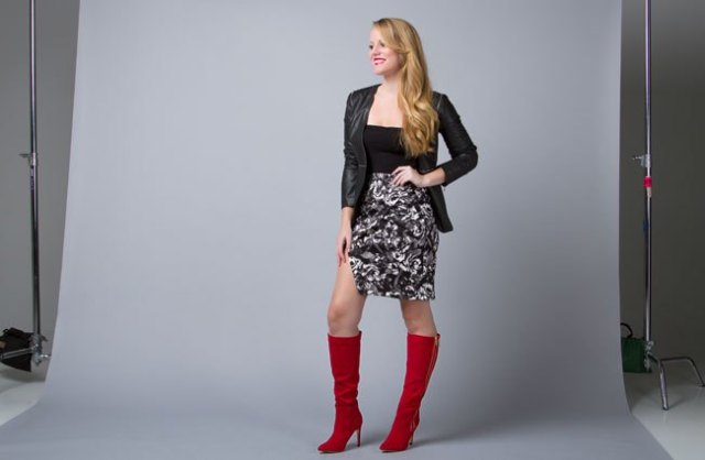 black leather jacket with a floral high-rise skirt and brown zipper boots