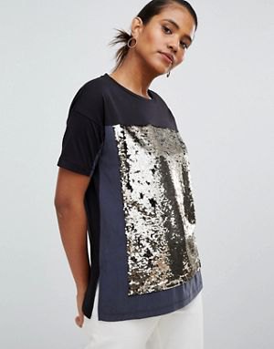 black and silver sparkling color block t-shirt with white jeans