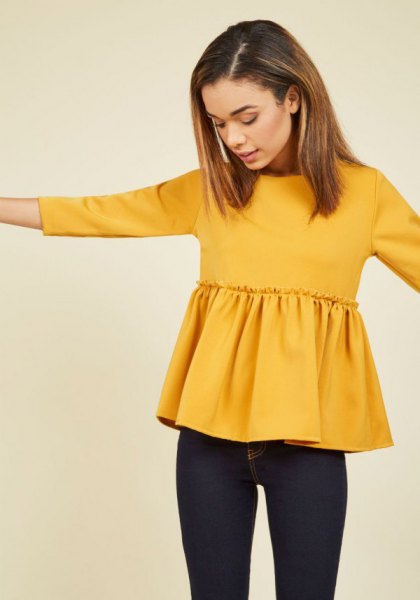 yellow peplum blouse with dark blue skinny jeans