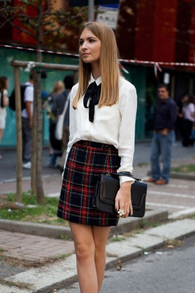 white bow tie blouse with red and black checkered mini skirt