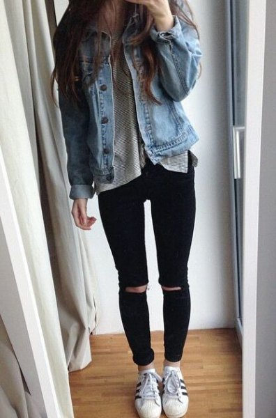 blue denim jacket with gray t-shirt and torn jeans