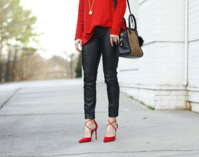 red sweater with black leather pants and strappy heels
