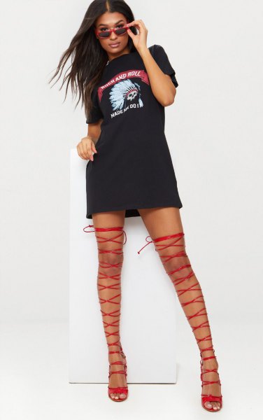 black graphic t-shirt dress with red, thigh-high gladiator heels