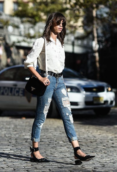 white shirt with buttons and blue jeans with cuffs