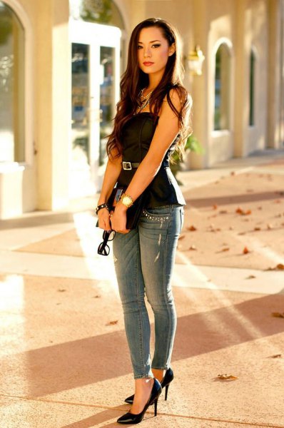 strapless black peplum top with belt and gray skinny jeans