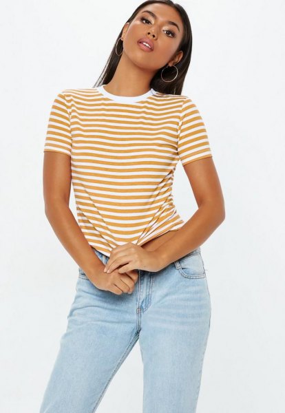 Mustard yellow and white striped t-shirt with light blue slim fit jeans