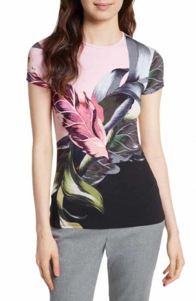 black white and pink floral printed t-shirt with gray slim fit trousers