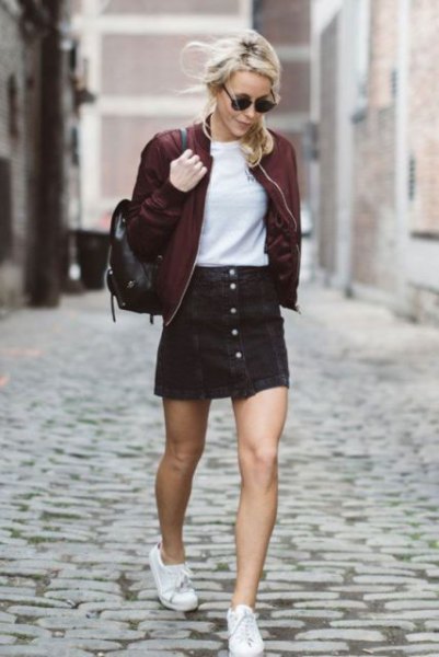 black bomber jacket with matching skirt with button on the front