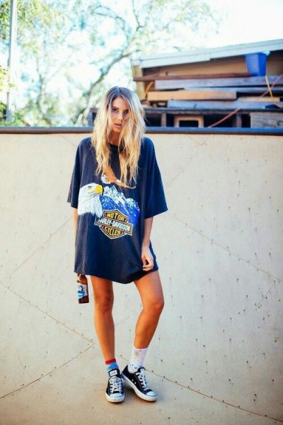 gray oversized graphic t-shirt with team socks and low trainers