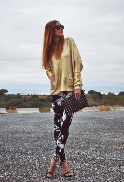 golden sweater with black and white leggings and open toe heels
