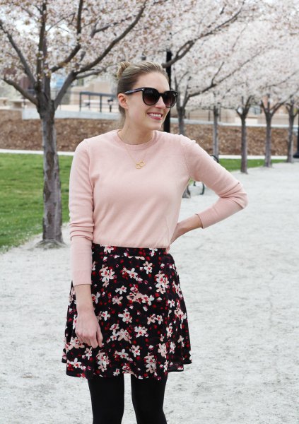 Blushing pink sweater with black and white floral mini skirt