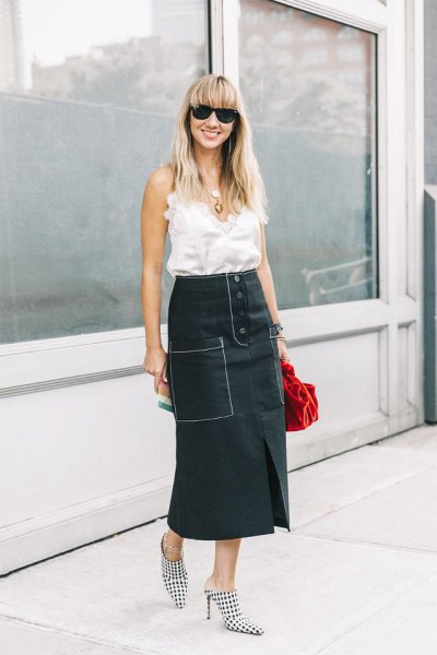white sleeveless ruffle top with black maxi skirt with high waist and relaxed fit