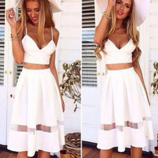 white, form-fitting crop top with high, flared midi skirt