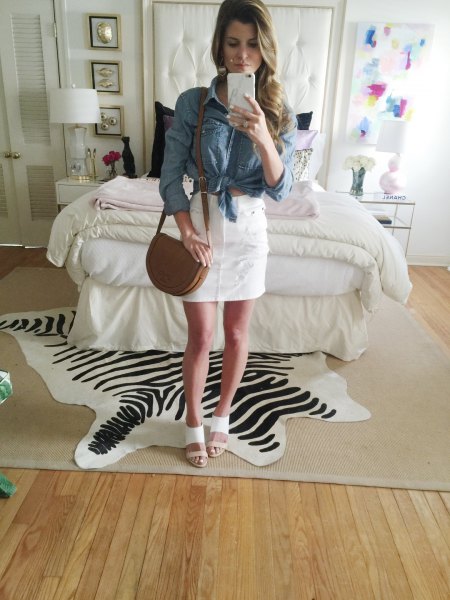 blue knotted chambray shirt with white high-rise mini skirt