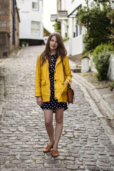 yellow rain jacket with black and white polka dot mini dress