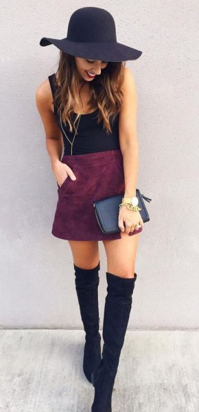black floppy hat with tank top and suede skirt