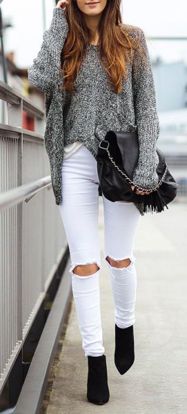 gray mottled, chunky sweater with torn white jeans