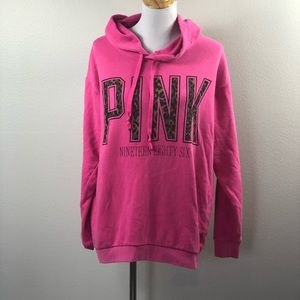 pink graphic hoodie with light blue skinny jeans