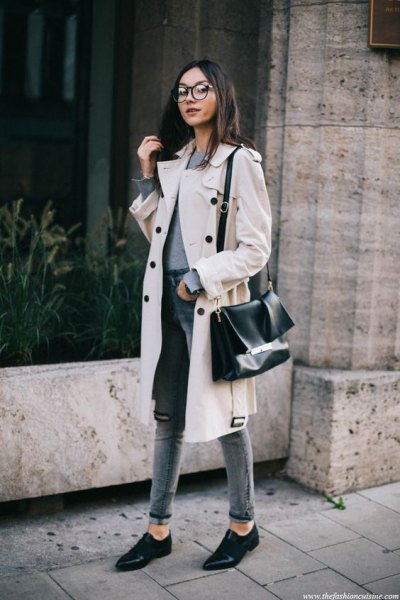 white midi winter trench coat with gray high waist slim fit cuffed jeans