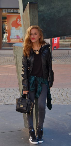black moto jacket with gray leggings and hidden wedge buttons with high top