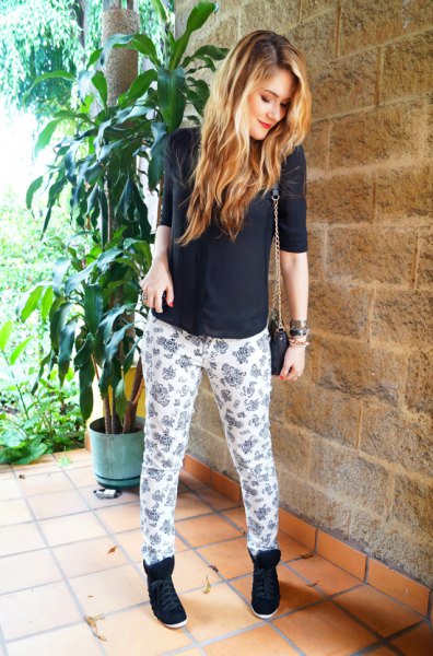 black halter sweater with white and pink printed casual fit pants