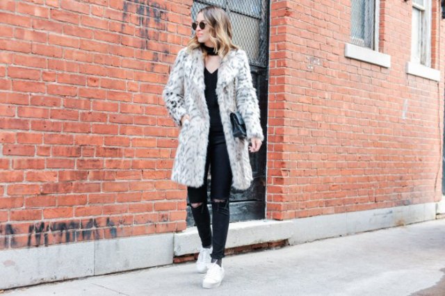 white faux fur long jacket with ripped jeans and sneakers