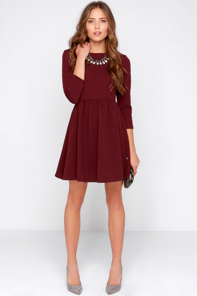 dark burgundy fit and flared mini dress with three quarter sleeves with gray heels