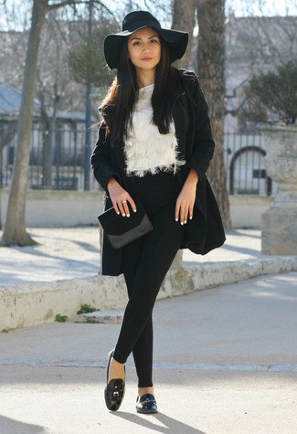 floppy black hat with wool coat and faux fur blouse