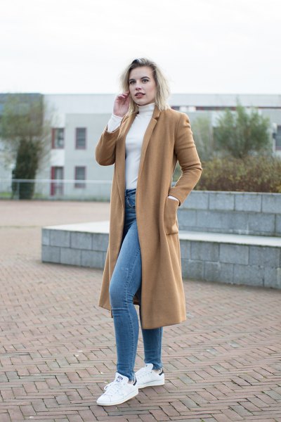 camel mid-length wool coat with white mock neck-shaped sweater