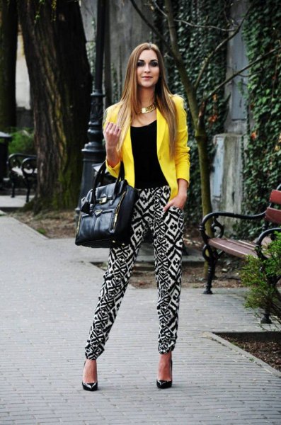 lemon yellow summer blazer with black vest top and trousers printed