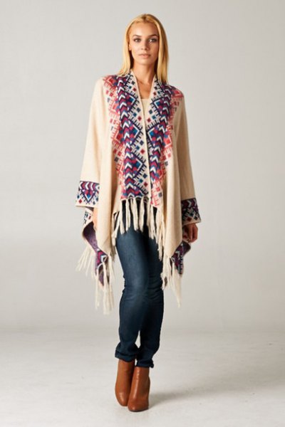white and navy printed cardigan with brown leather boots