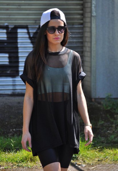black semi-tunic blouse with white crop top and mini skirt