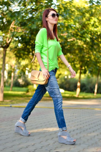 lime green buttonless shirt with blue cuffed slim fit jeans