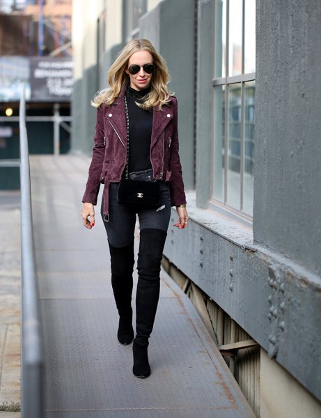 black moto jacket with hollow sweater and high thigh boots